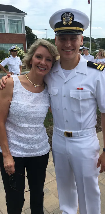 Dr. Daniel Wright in his military uniform hugging his mother