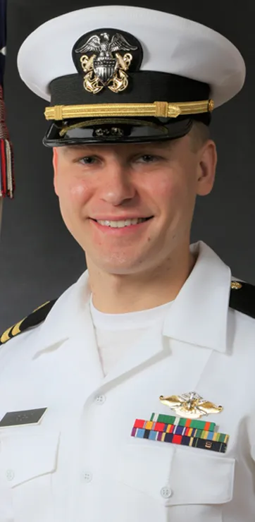 Dr. Daniel Wright sitting for a professional headshot photo in his military uniform
