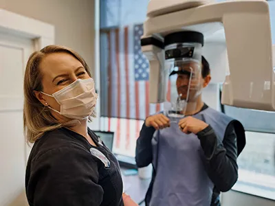 Orthodontist Batavia IL Fitting for Braces A staff member at Wright Orthodontics performing x-rays on a patient